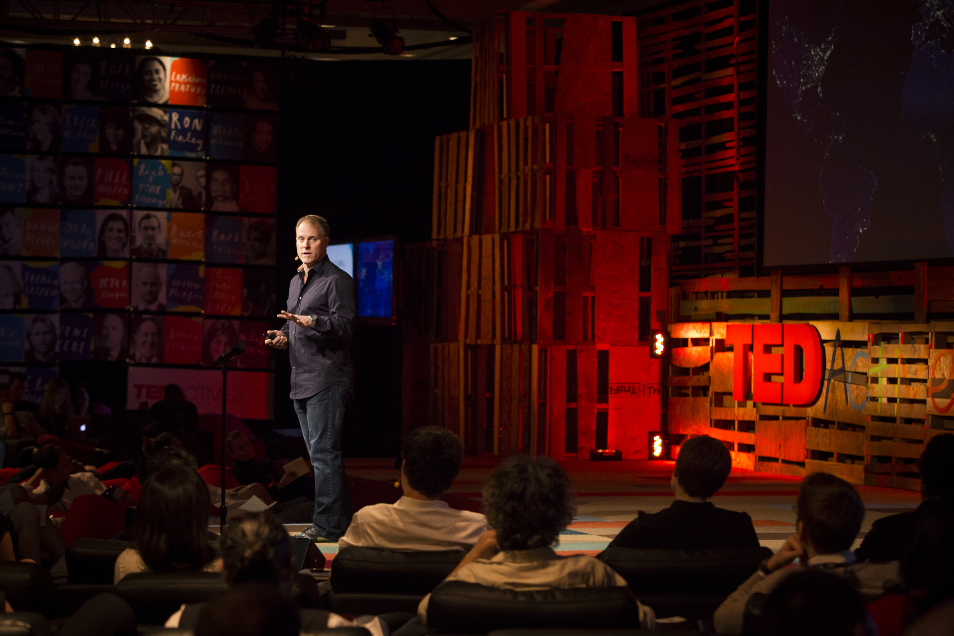 John Bates speaking on the TED stage at TEDActive